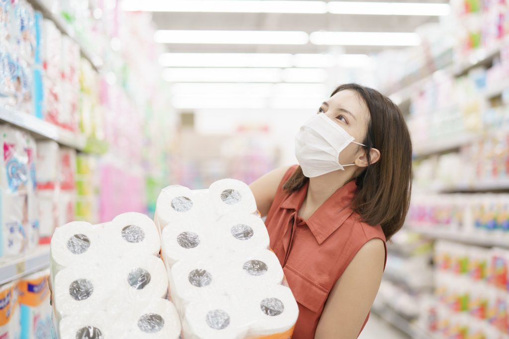 Woman panic buying due to Coronavirus at big supermarkets