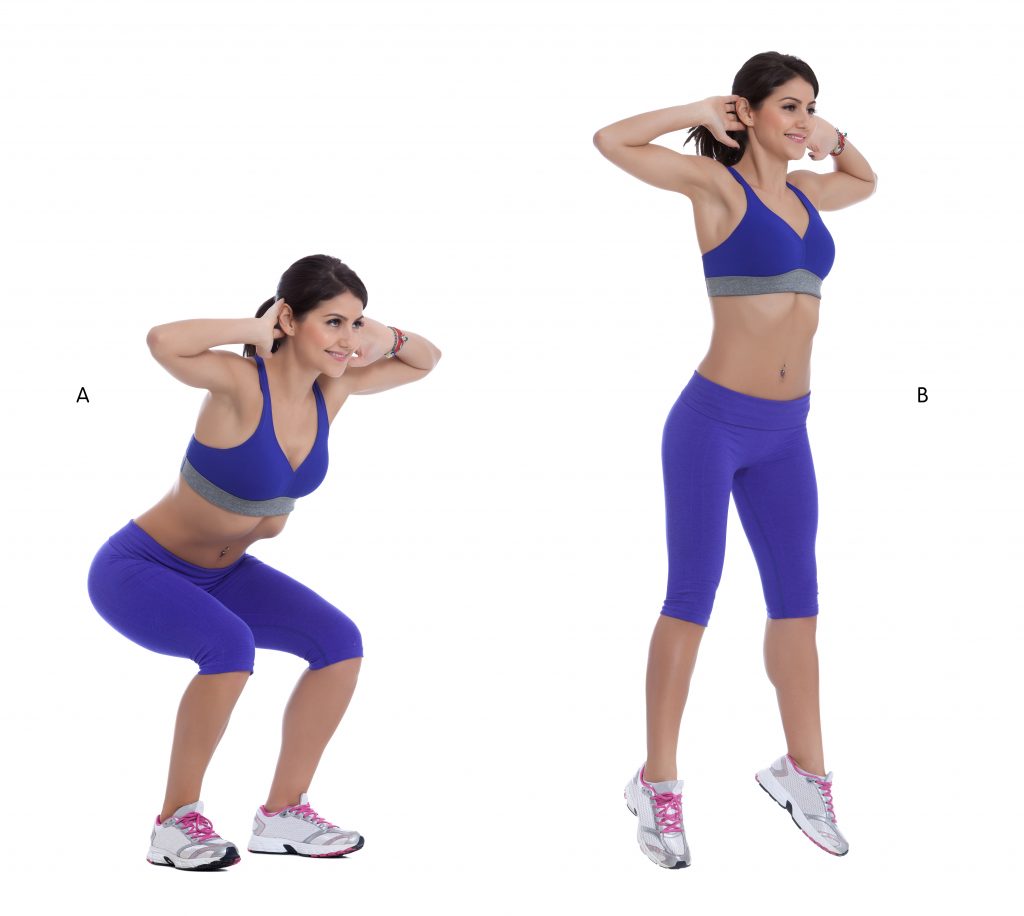 Woman doing squat jumps for at home workout