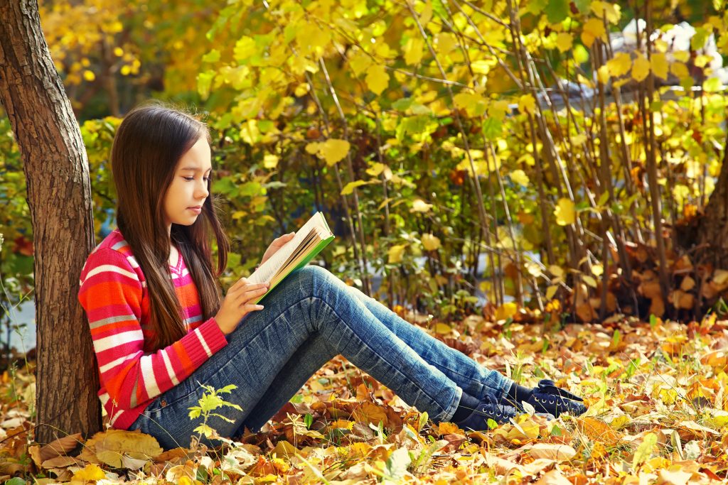 Reading outside in Autumn is a great way to spend an hour a day during Half Term. 